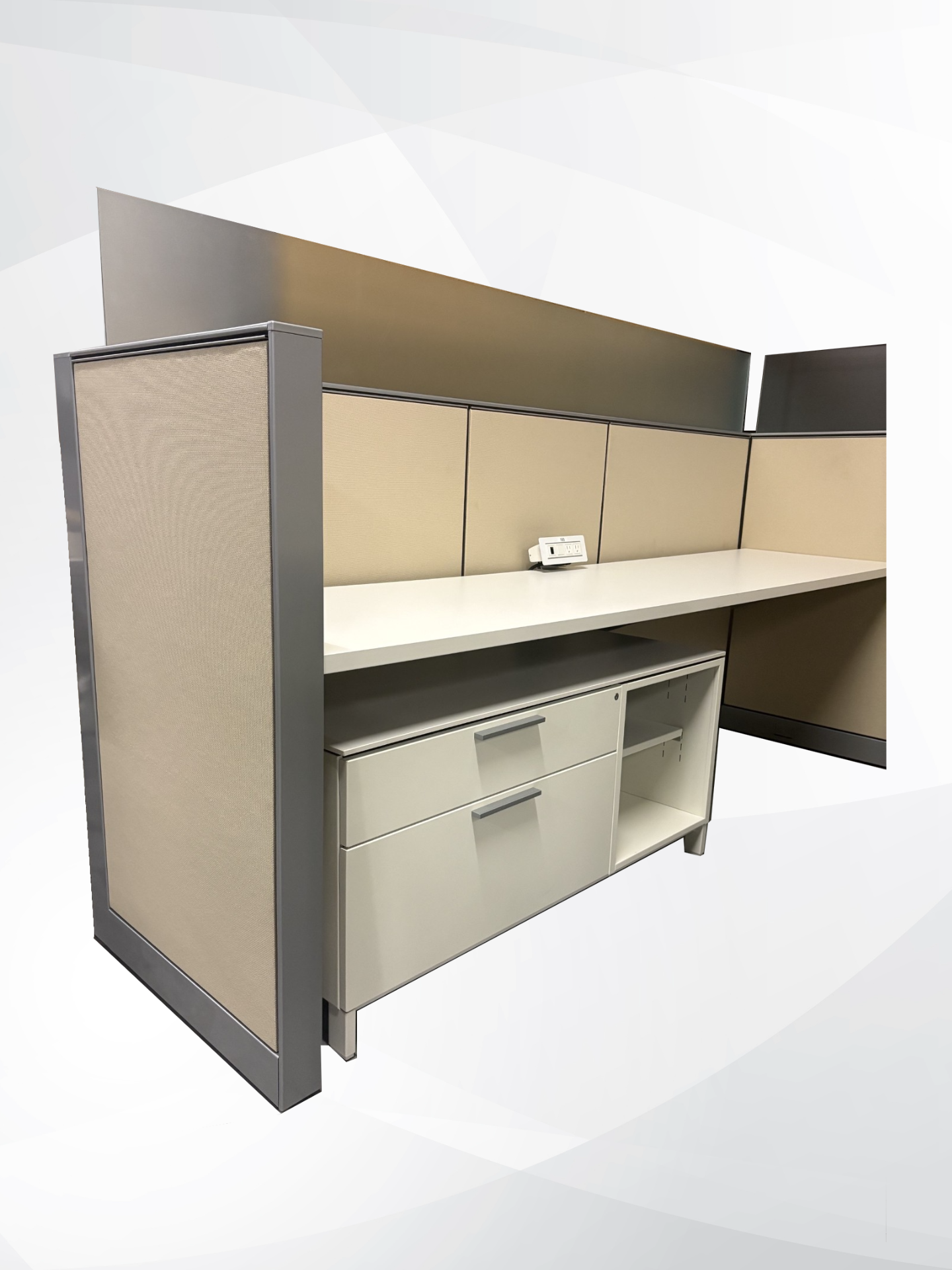 A modern office cubicle partition desk set with beige fabric panels, gray metal framing, and a light beige desk surface with storage drawers underneath.