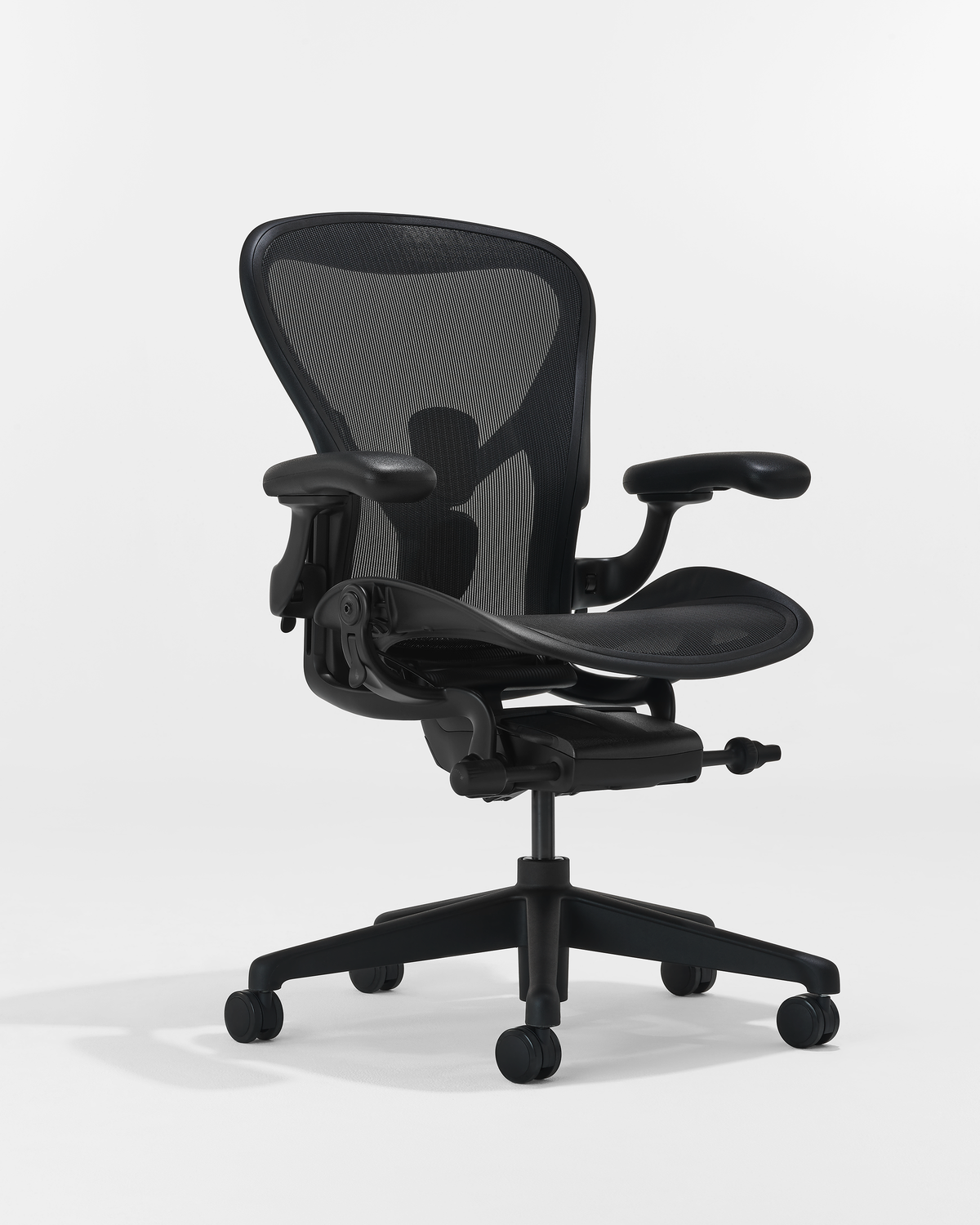 Side view of Herman Miller Aeron ergonomic office chair with adjustable armrests and breathable mesh construction