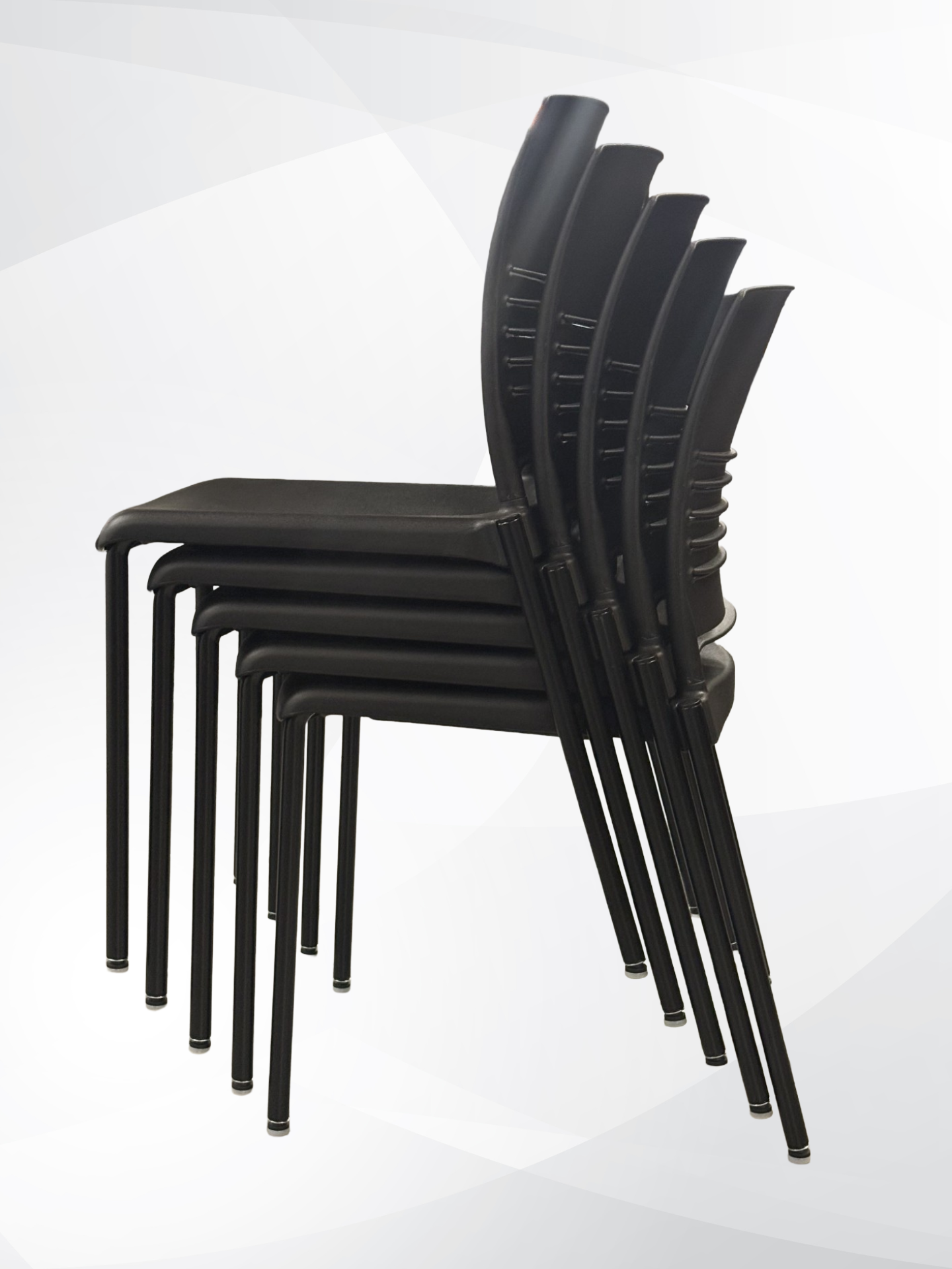 A stack of six black molded plastic chairs with metal legs, shown from a side profile view against a light gray and white background.