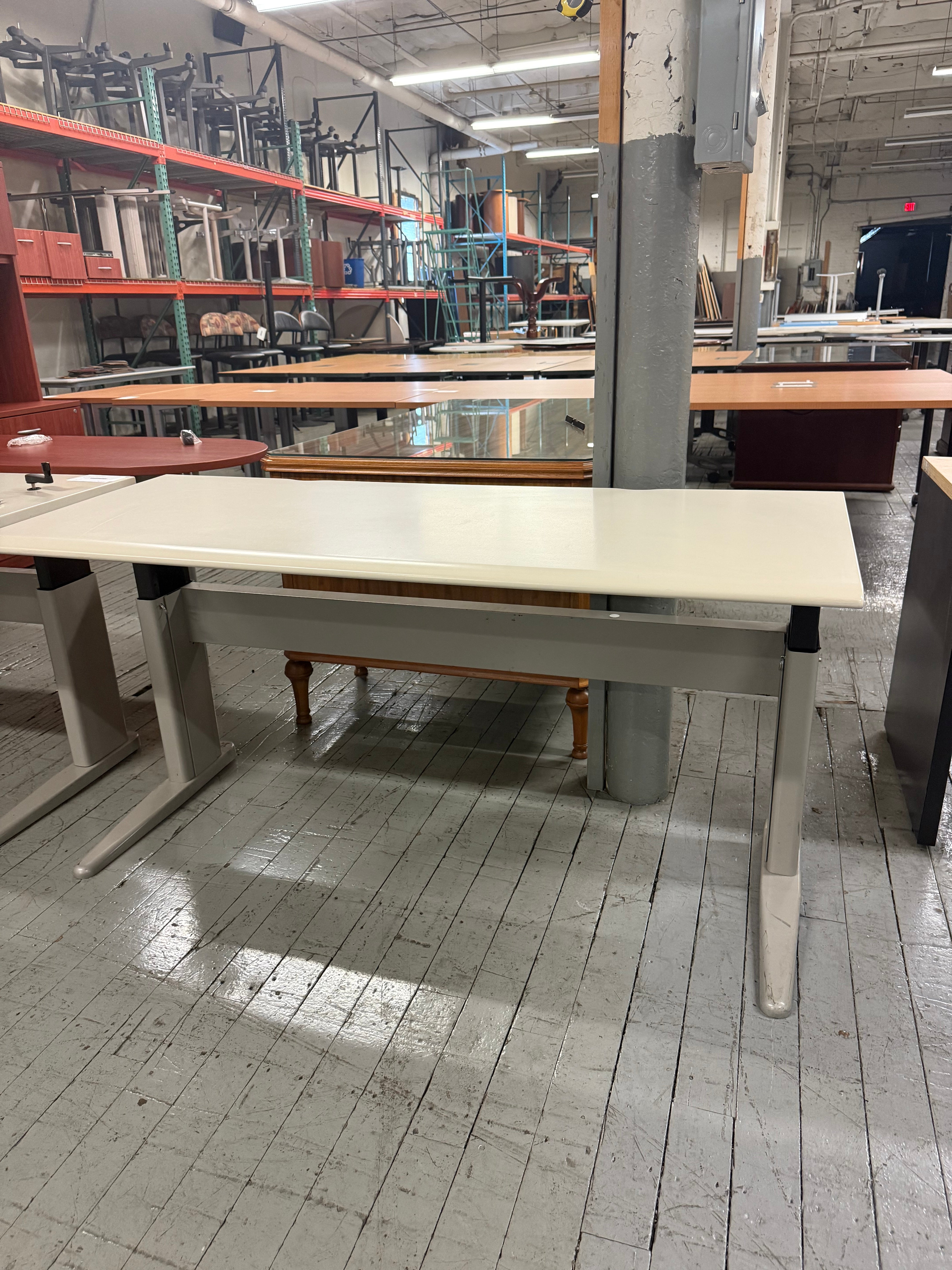 Pre-owned Herman Miller manual height adjustable table with ergonomic sit-stand functionality