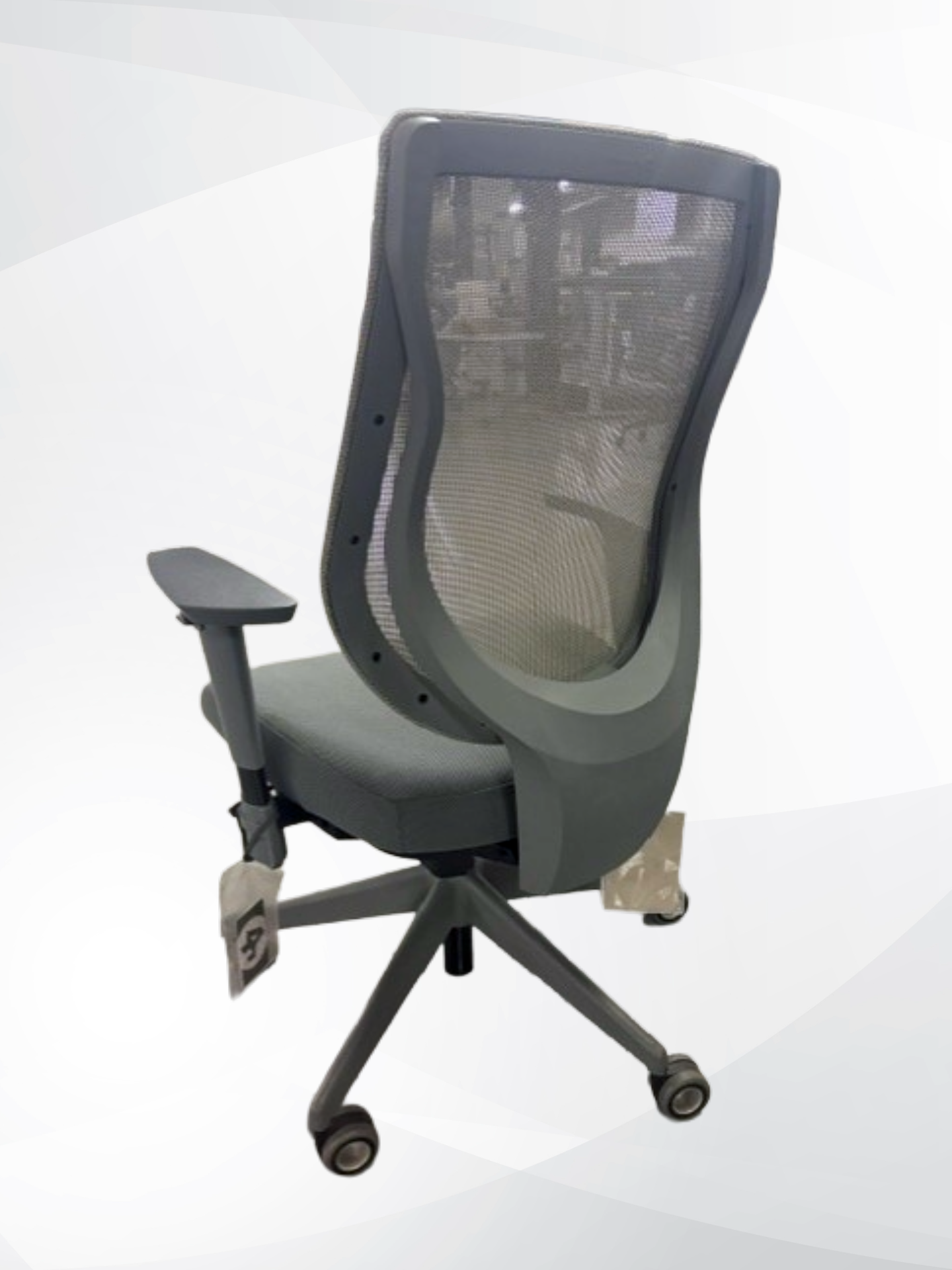A gray mesh office chair with a curved ergonomic backrest, padded armrest, and five-wheel base, shown against a light gray studio background.