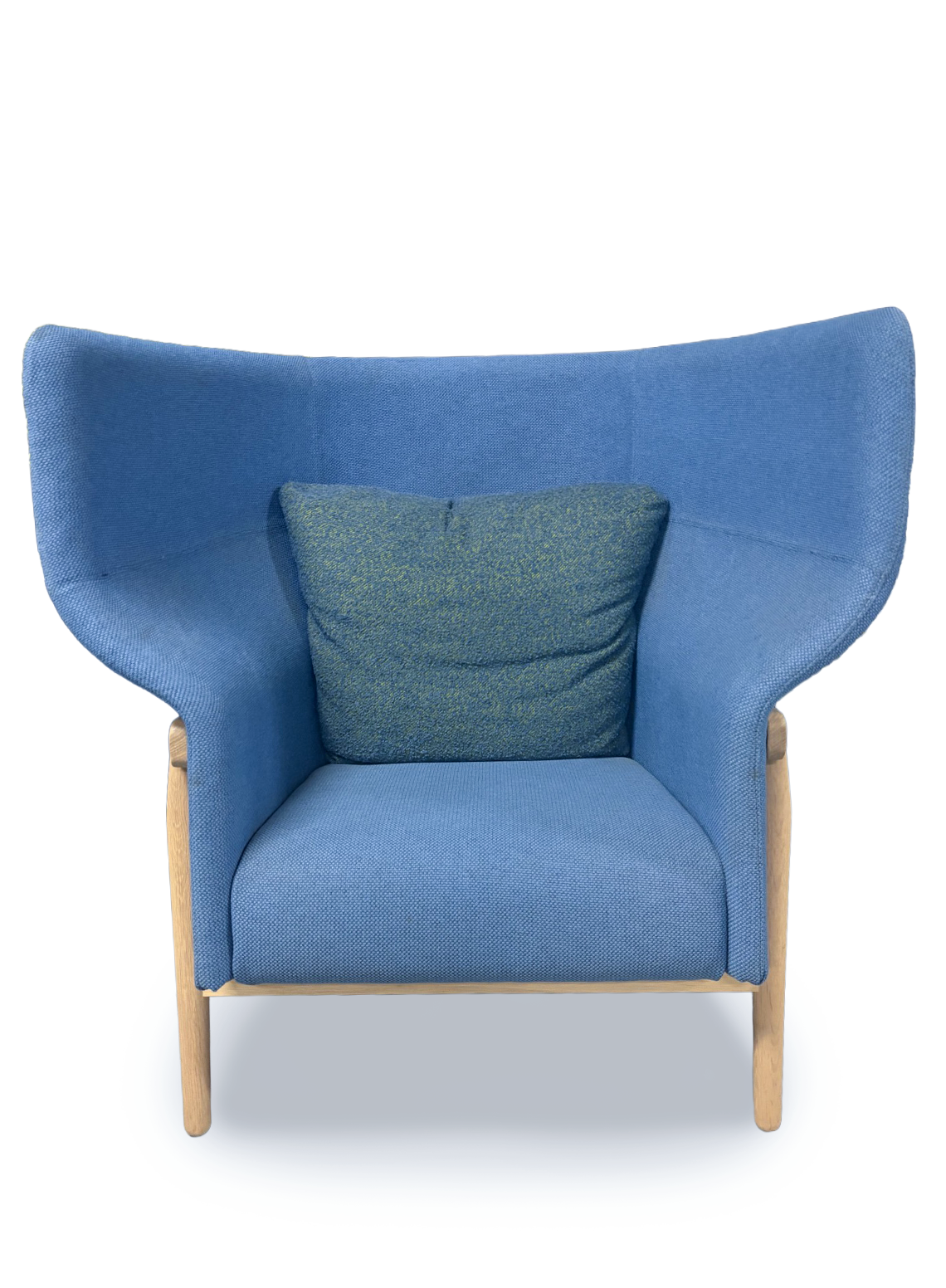 A modern blue upholstered accent chair with a high curved backrest, light wood legs, and a matching blue textured throw pillow, shown against a plain white background.