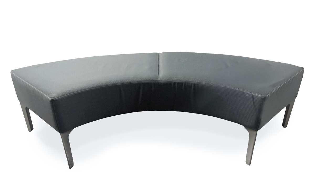 A curved upholstered bench or sofa with dark gray to black leather-like fabric and slim dark legs, photographed on a plain white studio background.