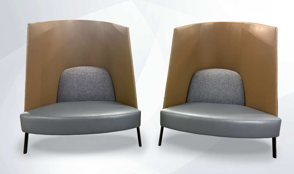 two high back lounge chairs brown and gray colors on soft gray background