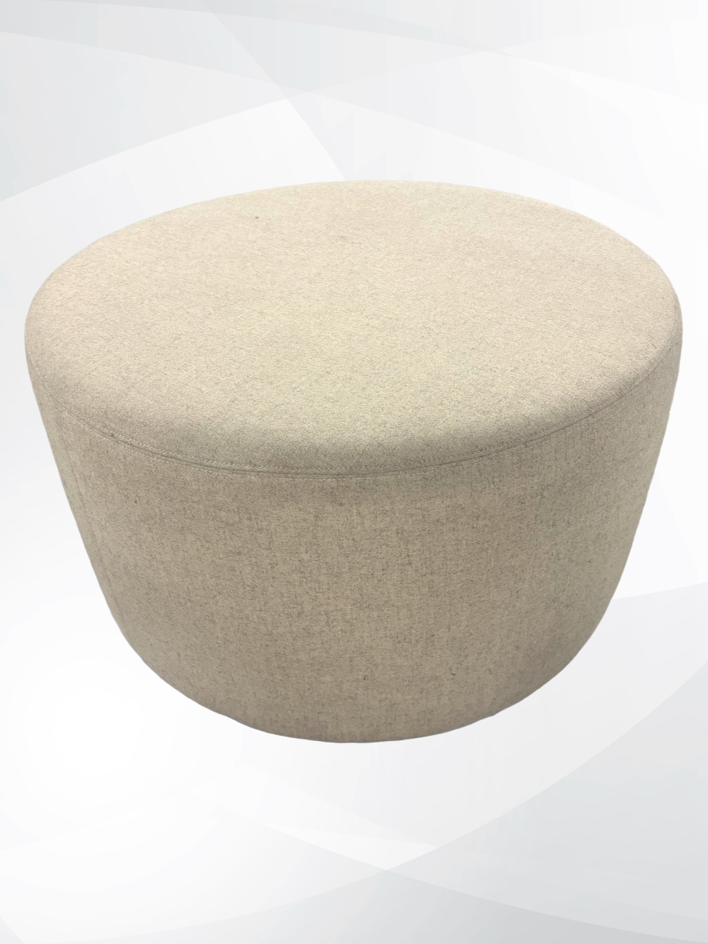 A round upholstered ottoman stool in a light beige textured fabric, shown against a light gray and white abstract background.