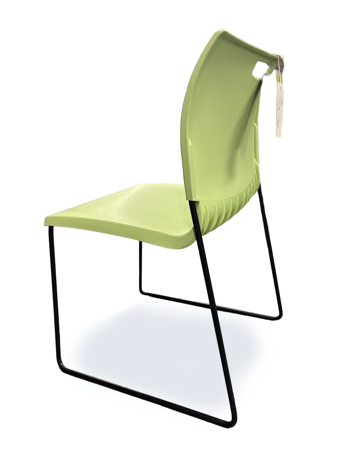 A light green molded plastic chair with a black metal sled base, shown from a back view angle on a white background.