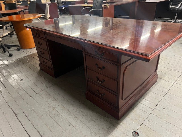 Executive wood desk set featuring storage drawers